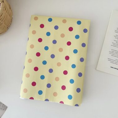 Yellow polka dot kraft wrapping paper for gift packaging