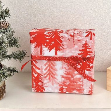 Red cedar Christmas wrapping paper with festive winter atmosphere